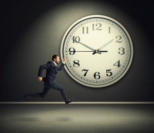 smiley running businessman and big white clock in dark room